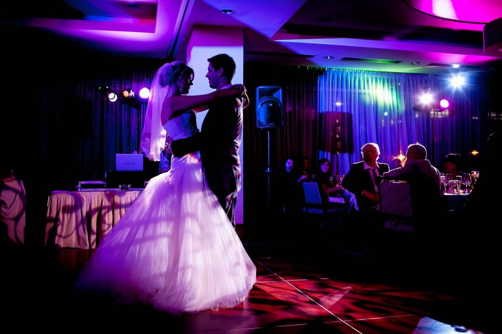 Professional wedding DJ setup with lighting and sound system at reception venue